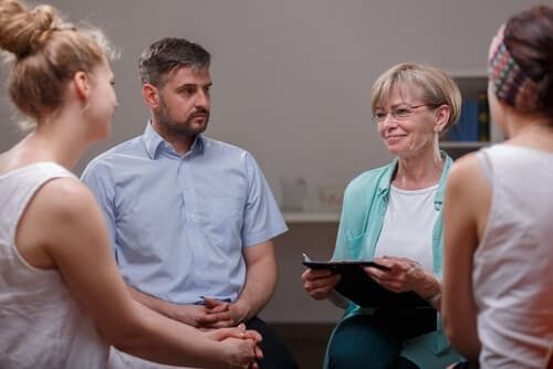 addiction recovery patients in a group therapy session