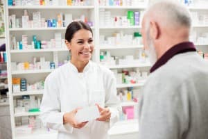 a pharmacist distributes medication