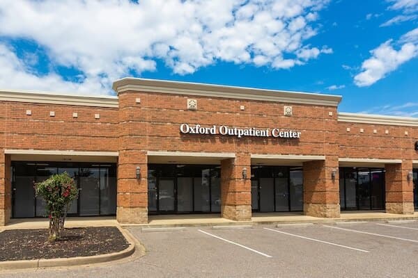 Brick office building with parking spaces out front, Oxford Outpatient Center Southaven